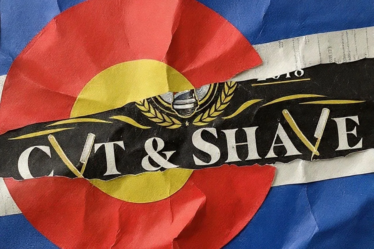 Cut & Shave logo sign over a Colorado flag